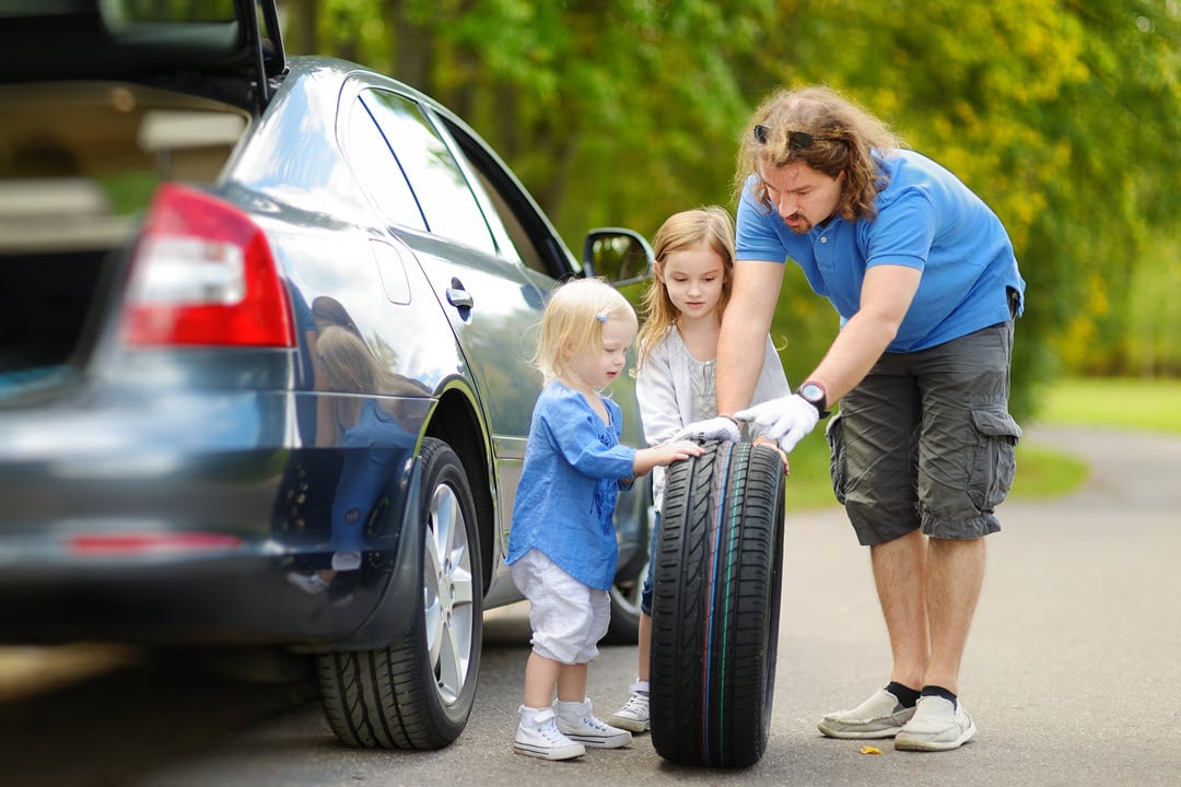 Volunteer to change a tire